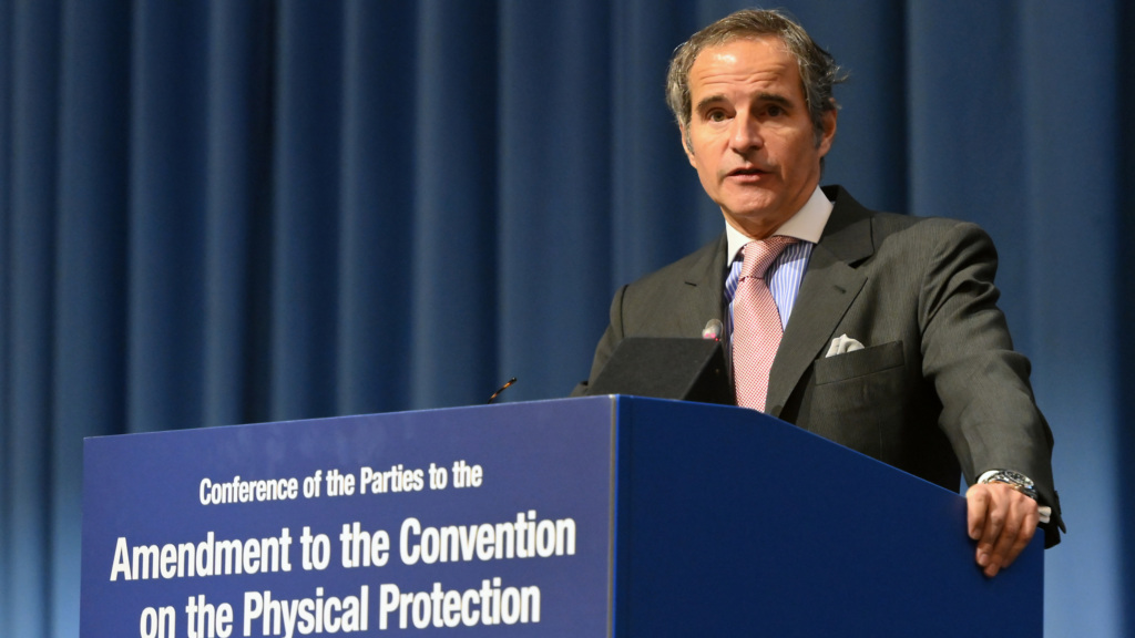 A photo of IAEA Director General Rafael Grossi speaking at a podium during the Review Conference for the Convention on the Physical Protection of Nuclear Material.