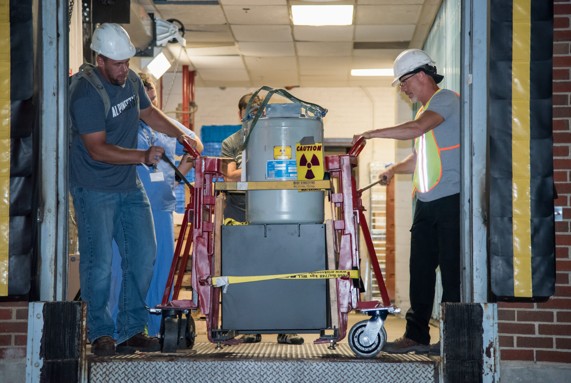 NNSA and Medstar Georgetown University Hospital staff work to remove a cesium-137 irradiator from the building on Aug. 7.